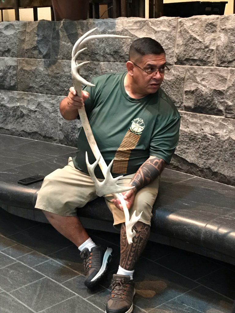 Man holding deer horn